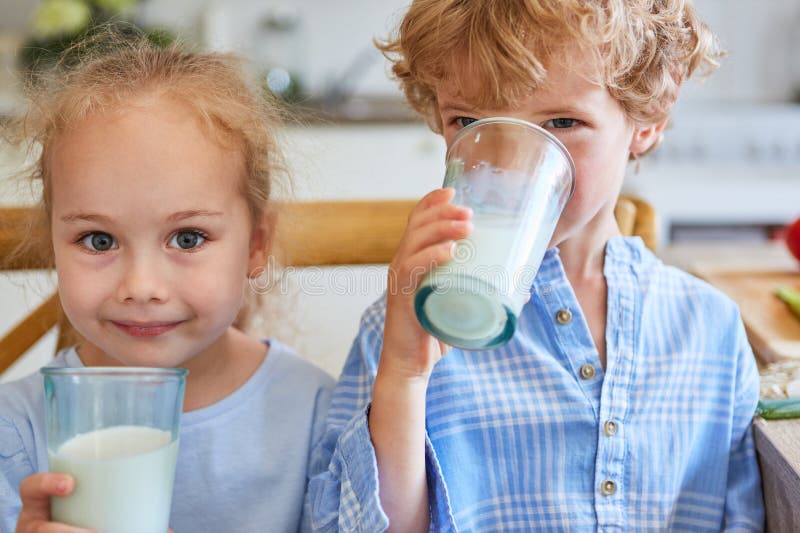 Brother and sister drinking milk