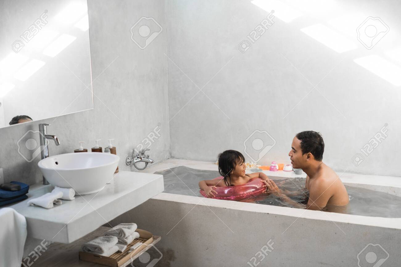 Dad and daughter sharing washroom