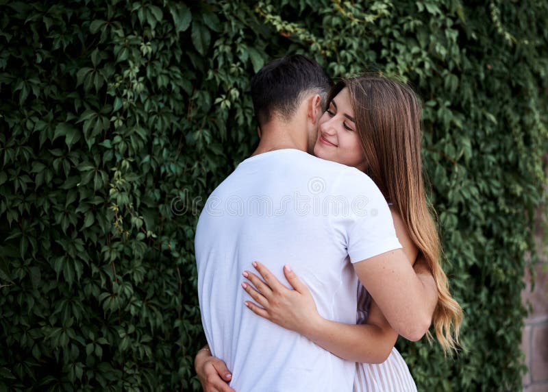 Man&woman hiding in bush kissing &pressing boobs