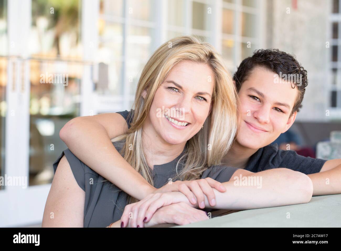 Portrait of a Latin mother and teenage son.