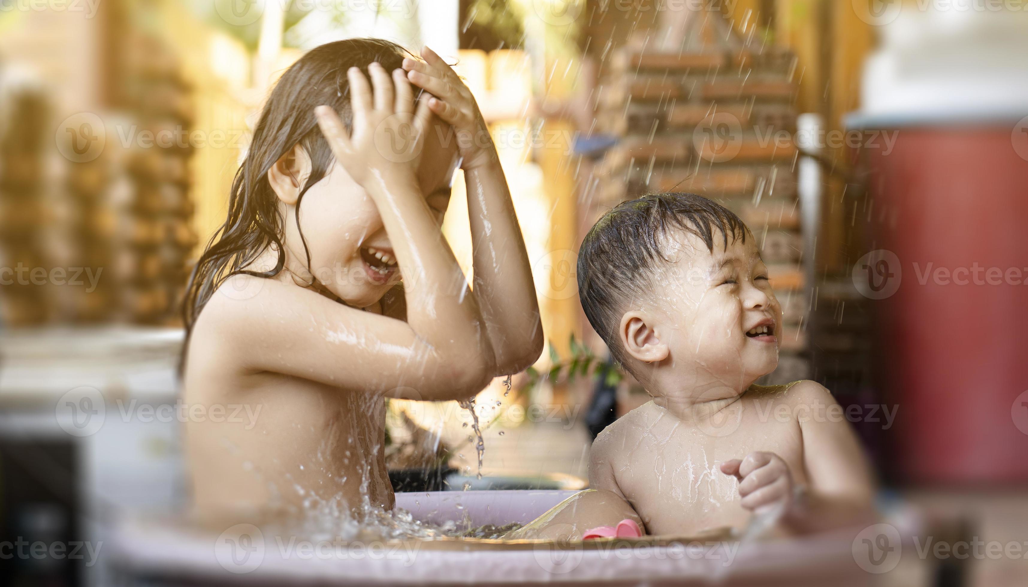 Brother sister bath Stock Photos