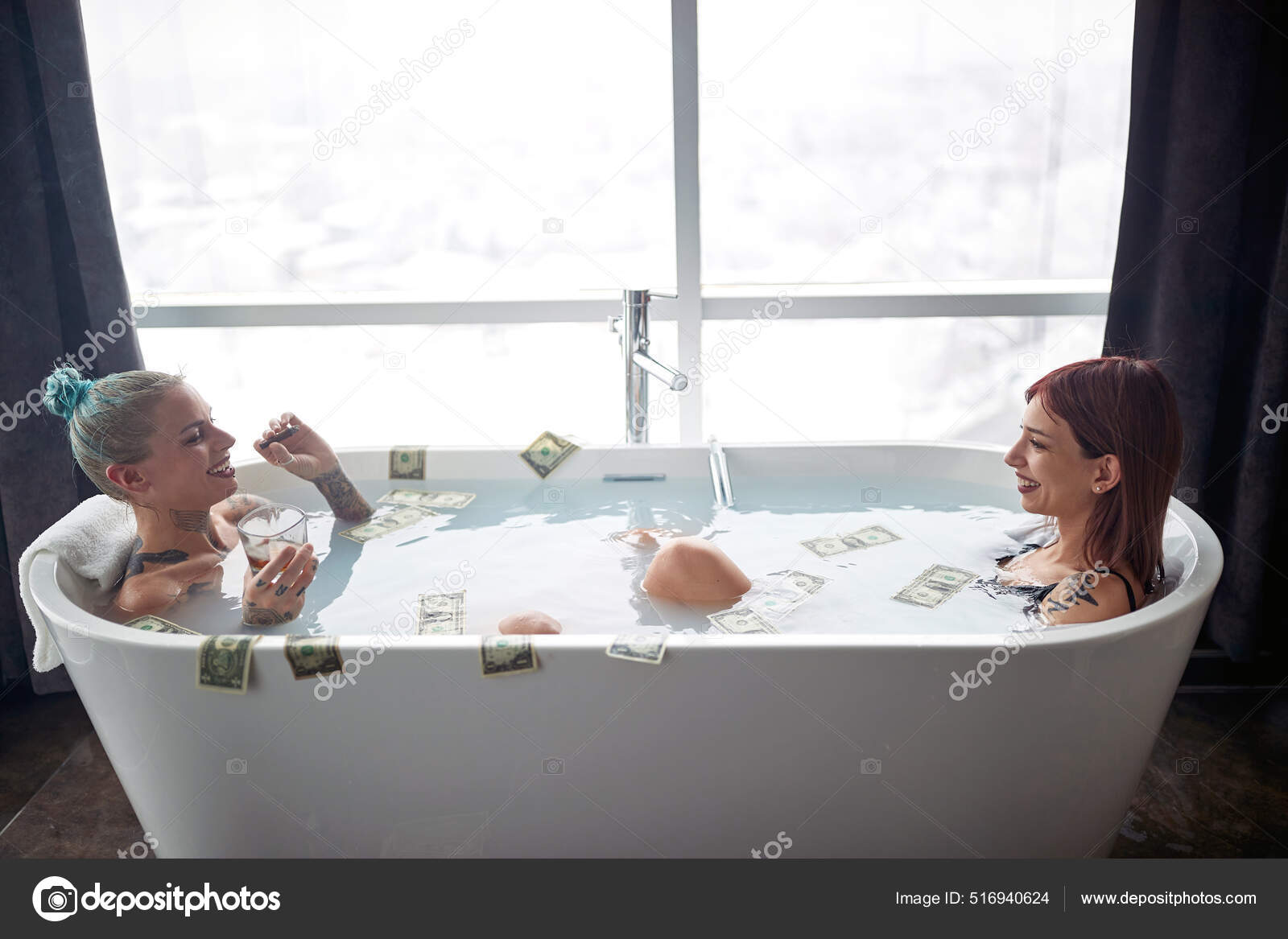 Beautiful blonde woman in swimsuit relaxing in bathtub on colorful background