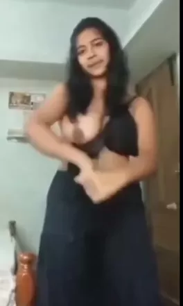 Desi girl removing clothes in field.