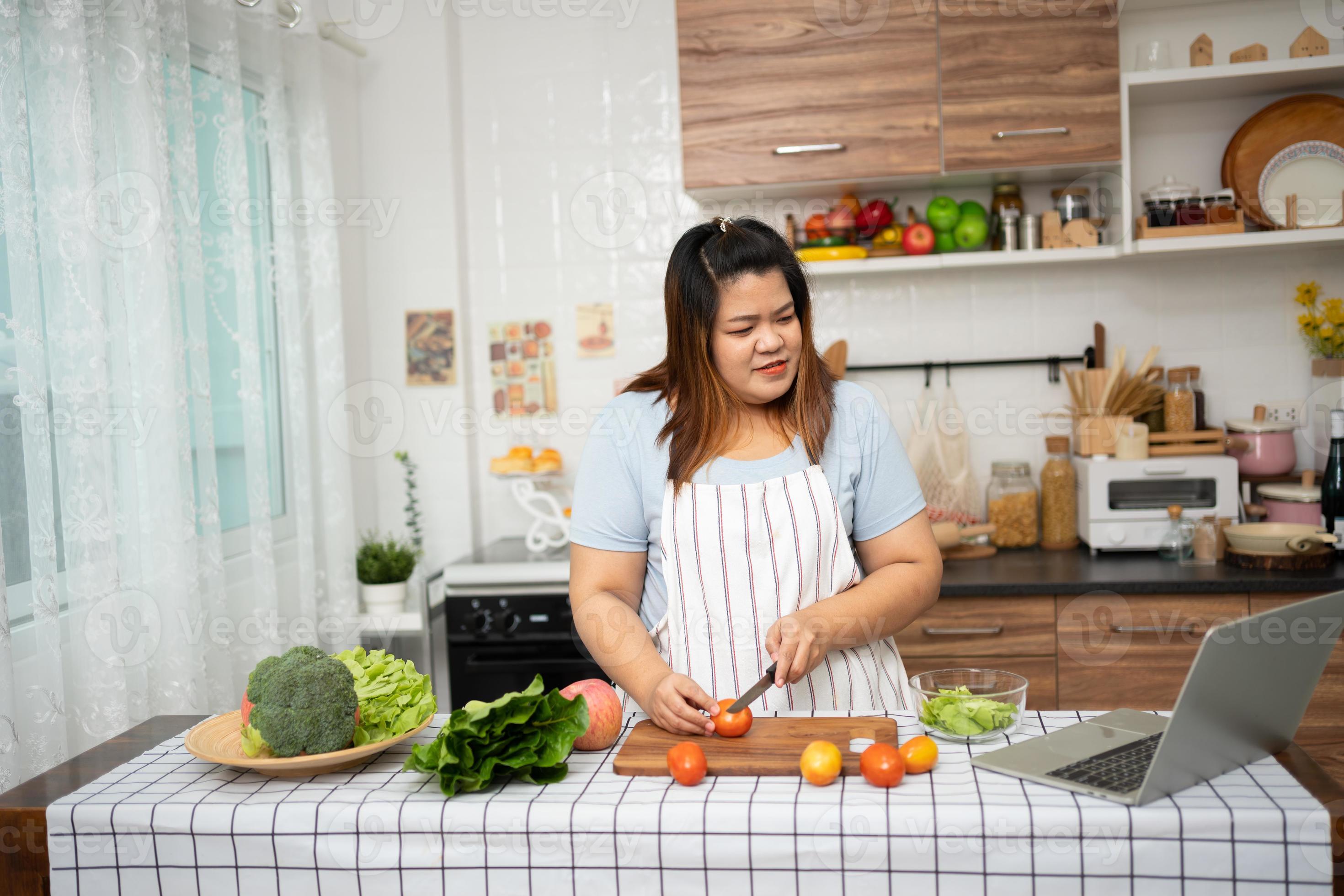 Fat Asian in kitchen