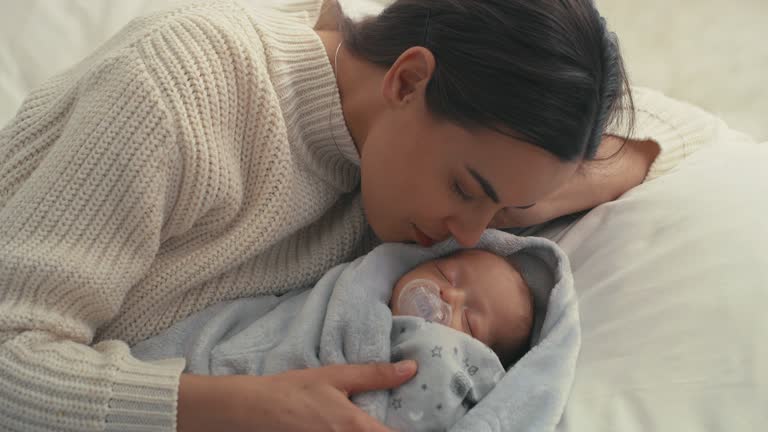 Mother And Son Sleeping In Bed Pictures, Images and Stock Photos