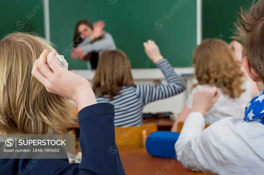 Students throwing paper balls to Teacher - Back to School